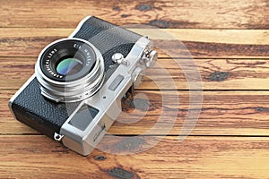 Modern mirrorless camera stilized to retro vintage film camera photo