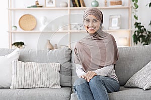 Modern Modesty. Portrait Of Beautiful Islamic Woman In Hijab In Home Interior