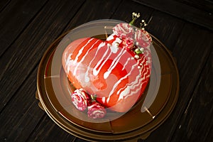 Modern mousse cake. Heart shape cake decoraited of roses. Concept for Wedding , St. Valentine`s Day, Mother`s Day