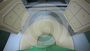 Modern MRI, tomograph, scanner, cat scan in action in bright clinic, medical laboratory. No people.