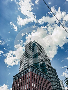 A modern multi-storey building. Summer, blue sky. Modern architecture. Eastern Europe