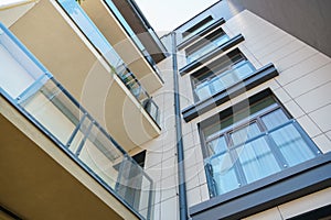 Modern multi-storey house in a new residential complex against the blue sky. The concept of mortgage housing lending and a happy