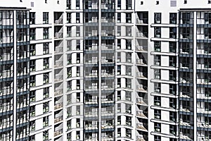 Modern multi-storey residential building. Background from a multi-storey modern house. Mortgage lending for a young family.