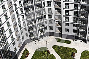 Modern multi-storey residential building. Top view of the courtyard of a modern house. Mortgage lending for a young family.