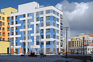 Modern Multi-Story Building with Colorful Exterior photo