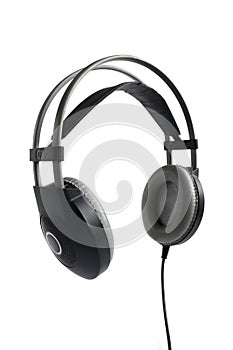 Modern music device. Wireless black headphones 3/4 view isolated on white background