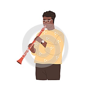 Modern musician playing clarinet. Black-skinned clarinetist performing jazz music on woodwind instrument. Afro-American