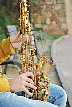 Modern musician posing with his saxophone