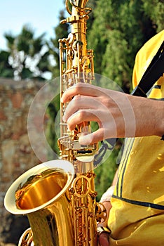 Modern musician posing with his saxophone