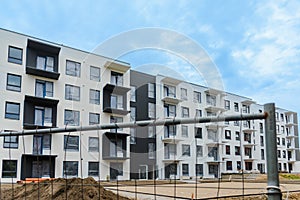 Modern and new apartment building. Multistoried modern, new and stylish living block of flats. construction site in the summer