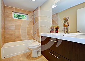 Modern new bathroom design with sink and white tub.