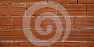 Modern new large red brick wall orange bricks background new wall texture site under construction