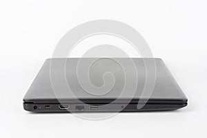 Modern, new office  black  laptop  on white background, side view. USB 2.0 port, RJ-45, HDMI port