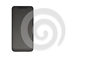 Modern new smartphone close-up in black on a white background with a copy space as a mock-up for placing any image on the screen