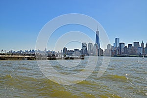 Modern New York City Viewed from Liberty State Park across Hudson River on a sunny day