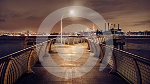 Modern Night Pier in Brooklyn with view to New York City Skyline Manhattan Midtown Panorama with skyscrapers