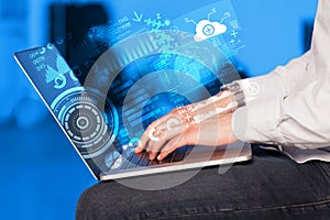 Modern notebook computer with future technology symbols