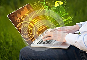 Modern notebook computer with future technology symbols