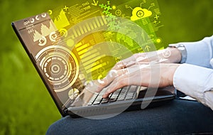 Modern notebook computer with future technology symbols