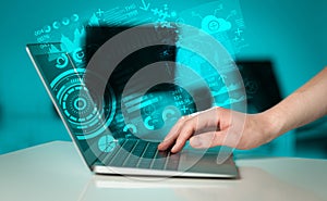 Modern notebook computer with future technology symbols