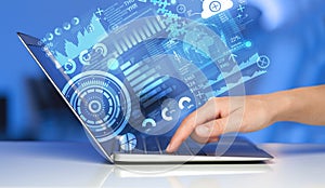 Modern notebook computer with future technology symbols