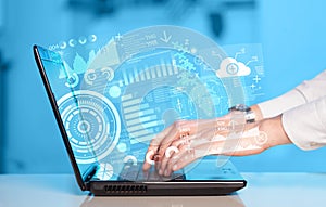 Modern notebook computer with future technology symbols