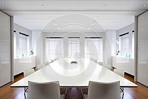 Modern office boardroom filled with light.