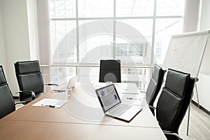 Modern office boardroom interior with conference table and big w