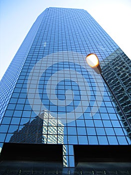 Modern office building against blue sky.