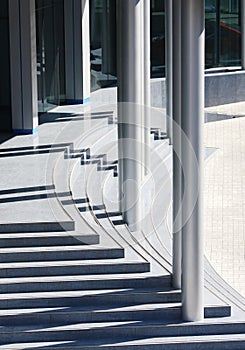 Modern office building entrance, steps and pillars