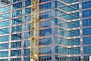 Modern office building with facade of glass.