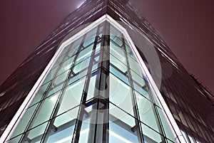 Modern office building with facade of glass.