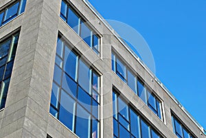 Modern office building with facade of glass.