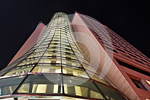 Modern office building with facade of glass.