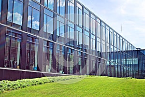 Modern office building with facade of glass.