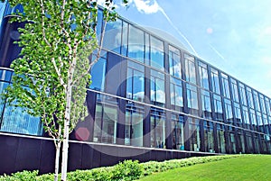 Modern office building with facade of glass.