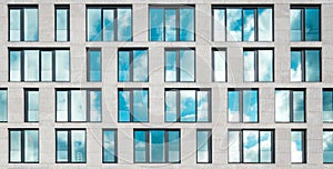 Modern office building facade , window facade with sky reflection