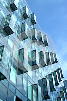 Modern office building glass wall side view close-up