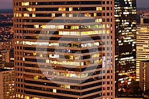 Modern office building at night.