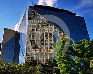 Modern office building and the old TVR headquarter in the mirror photo