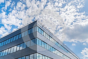 Modern office buildings in the background of the sky with clouds.