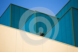 Modern office buildings. Colorful buildings in a industrial place. Blue and yellow windows.