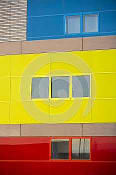 Modern office buildings. Colorful buildings in a industrial place. Yellow, blue and red windows.