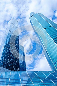 Modern office buildings. Low angle shot of modern glass skyscrapers against the sky, Moscow city, Russia.