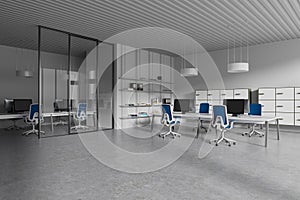 Modern office business interior with coworking zone and shelf with decoration