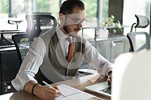 Modern Office Businessman Working on Computer. Portrait of Successful Middle-aged IT Software Engineer Working on Laptop