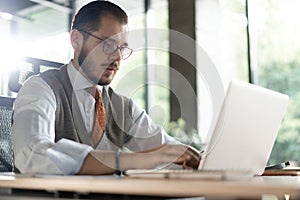 Modern Office Businessman Working on Computer. Portrait of Successful Middle-aged IT Software Engineer Working on Laptop