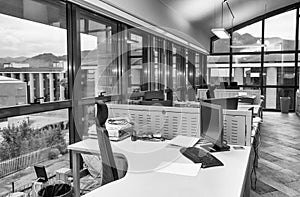 Modern office with cluttered desktops. Business concept photo