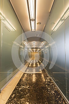 Modern office corridor with glass doors