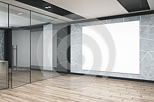 Modern office corridor interior with empty white mock up billboard, glass doors, furniture and wooden flooring. Architecture and